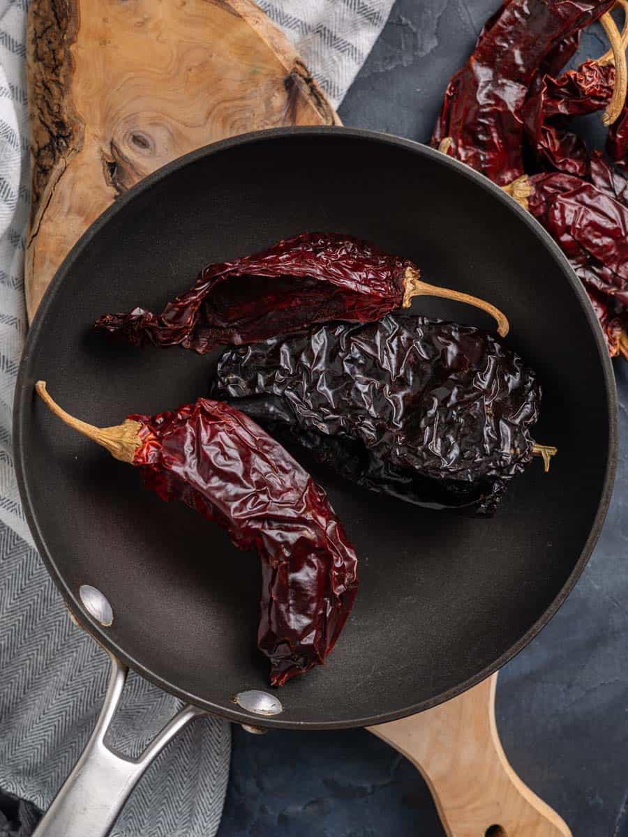 dried chiles toasted in a saute pan