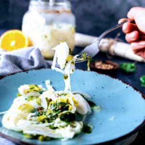 Pickled Cabbage on Plate, taking a spoonful.