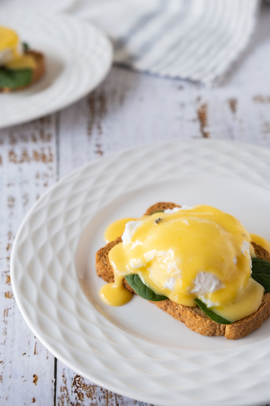 Poached egg on toast with hollandaise sauce.