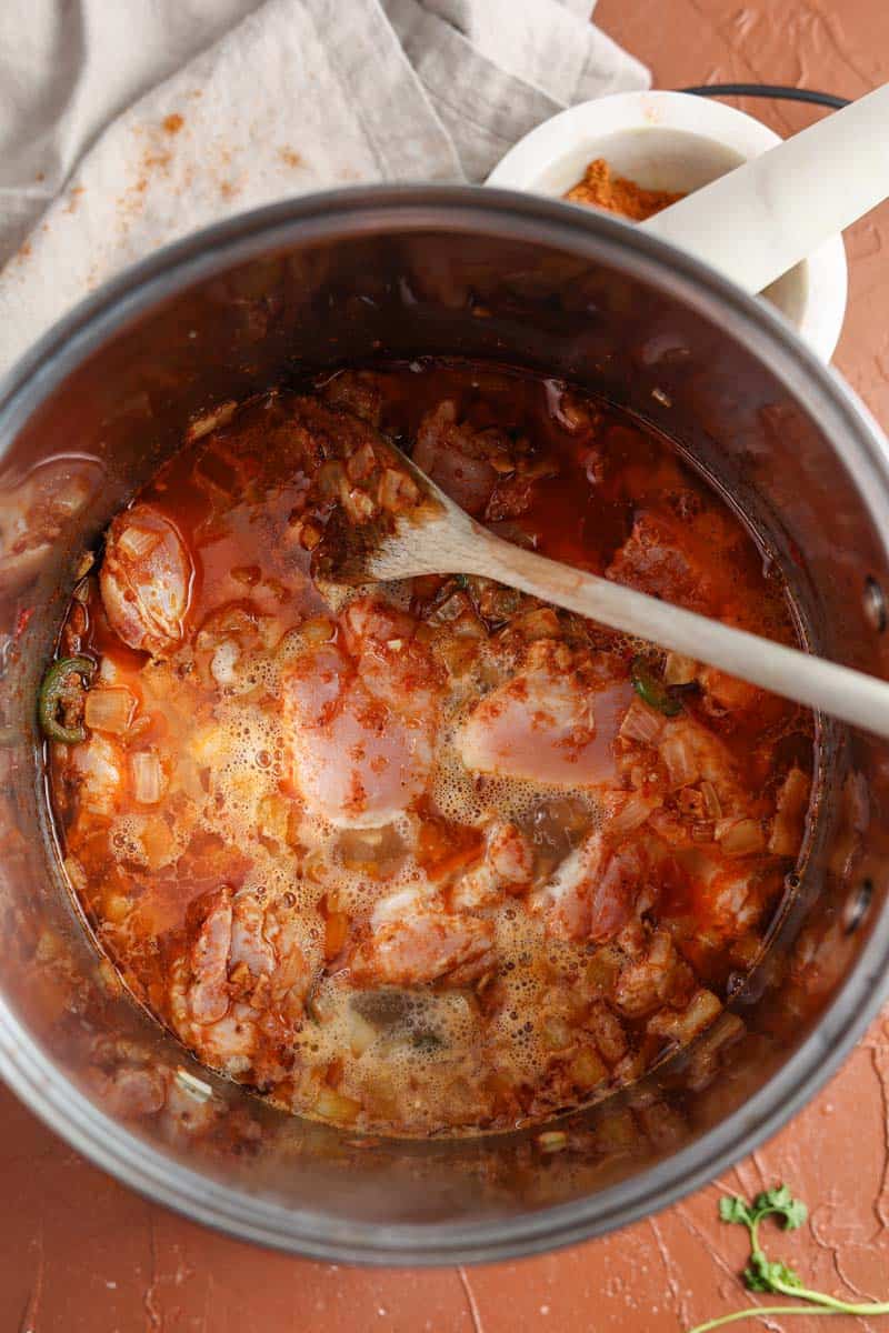 onions, peppers and spices in a pot