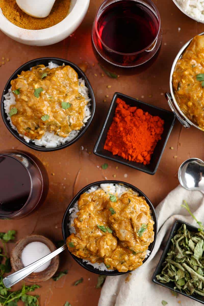 vadouvan curry chicken and cardamom rice in bowls