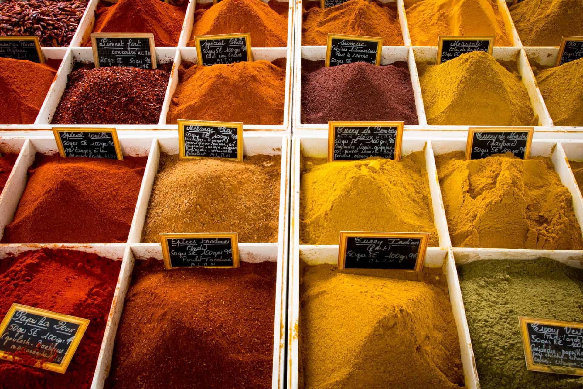 Spice vendor display of many varieties of spices.