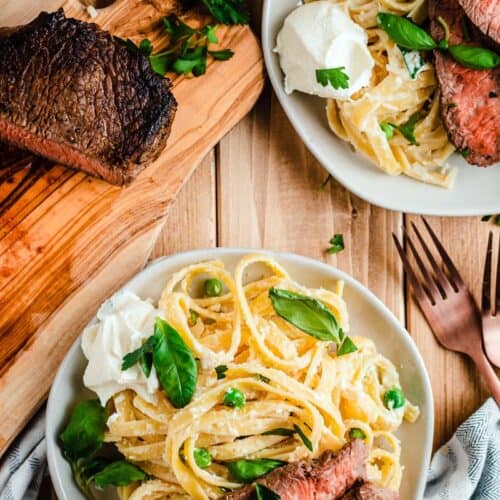ricotta basil fettuccine and steak on plate