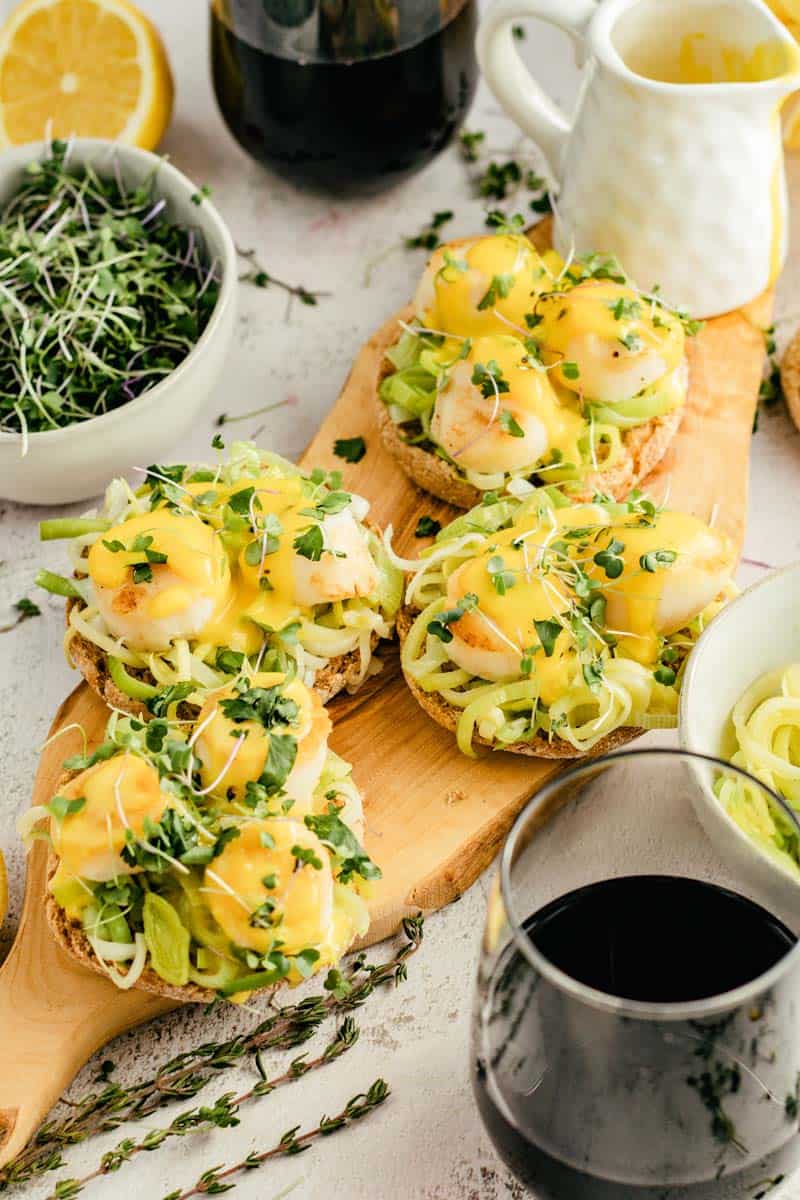 scallop benedict on cutting board