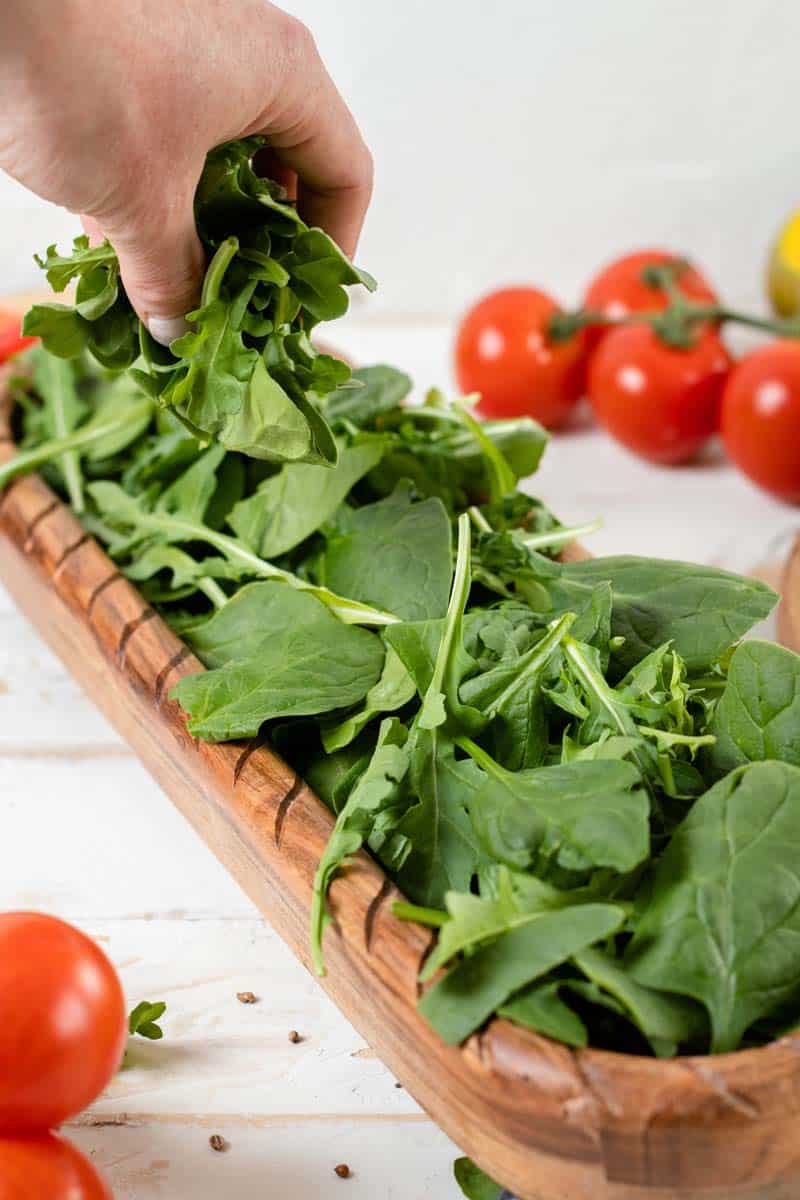 arugula and spinach leave on platter