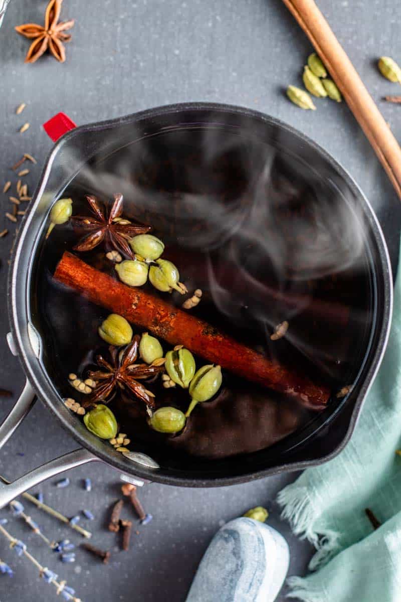 chai spices boiling in pot