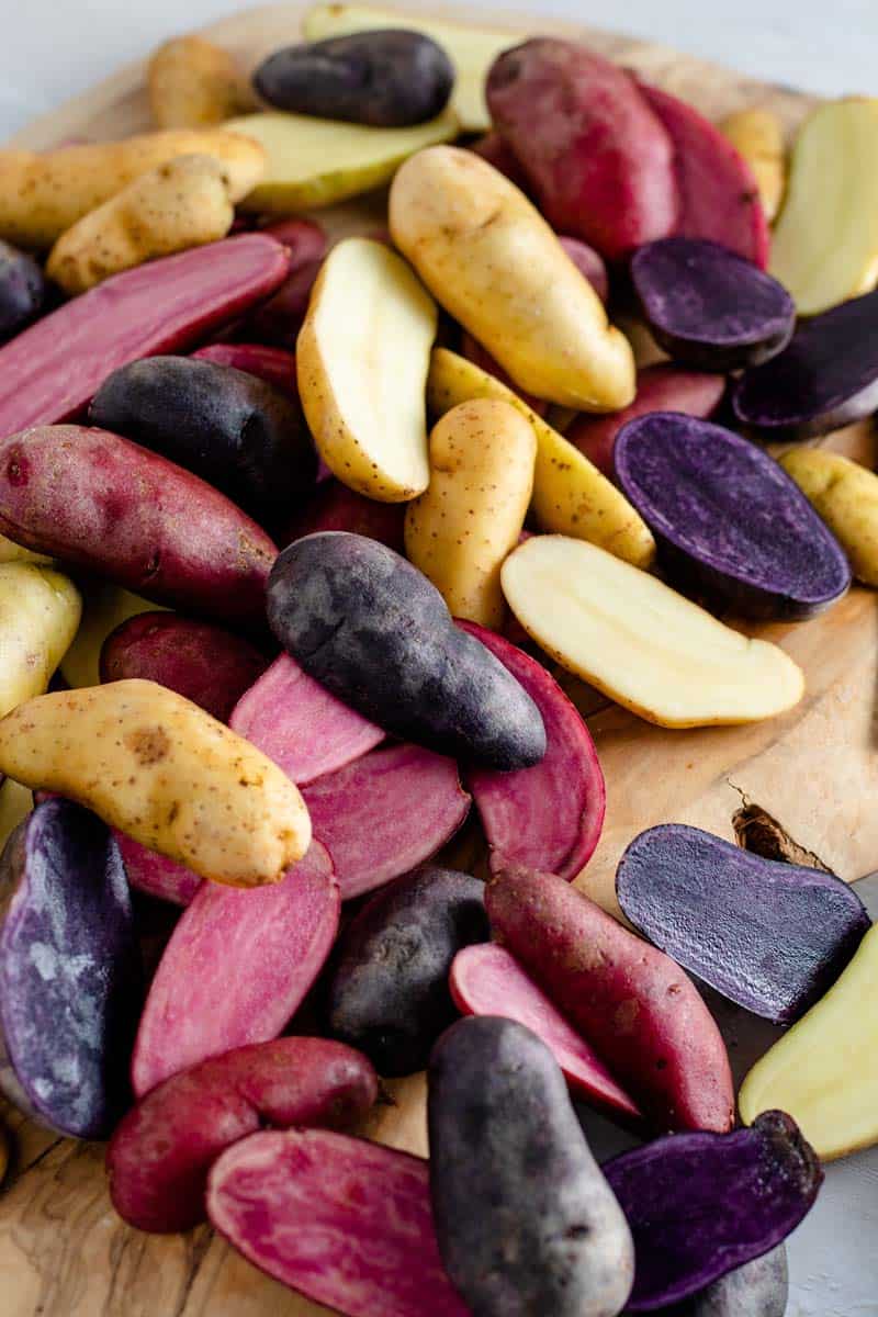 cut fingerling potatoes on cutting board