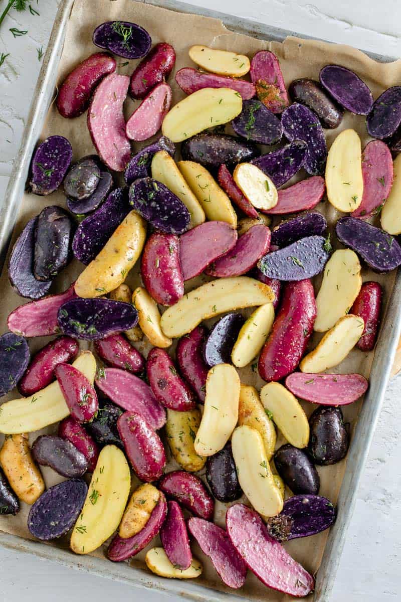 roasted fingerling potatoes on baking sheet before cooking