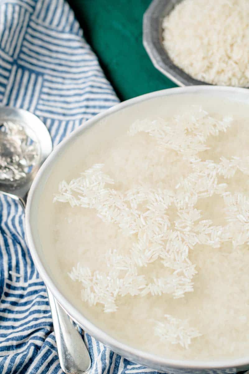 rice soaking in a bowl in water