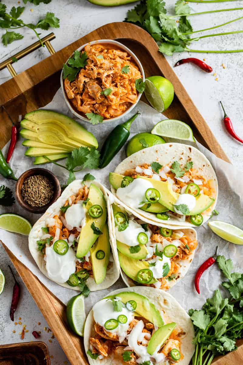 tinga de pollo tacos on a platter