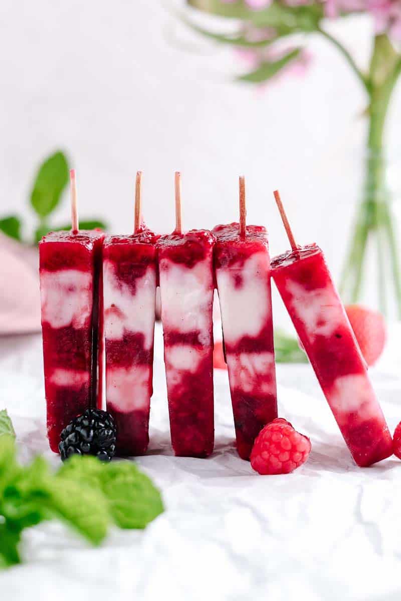 masala berry popsicles lined up in a row