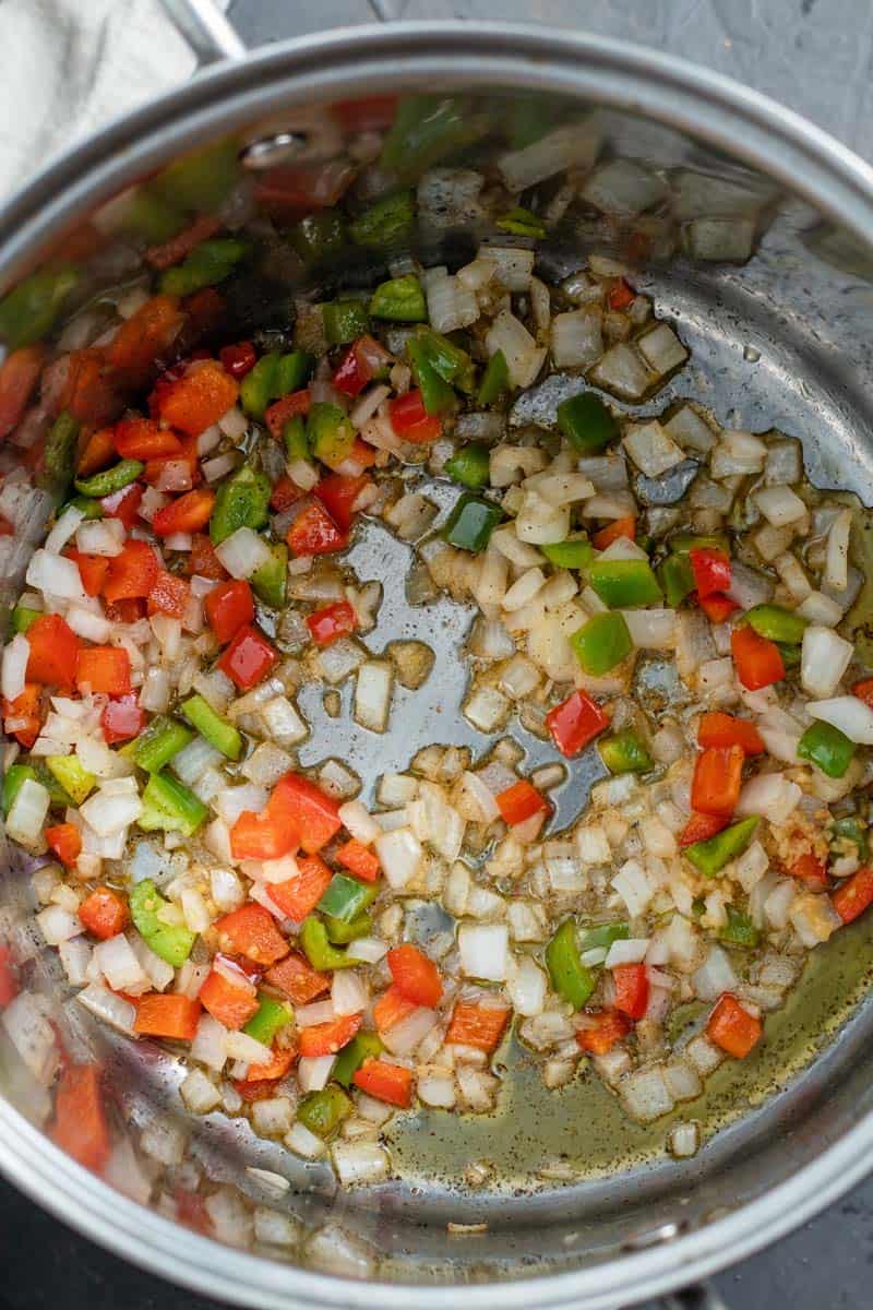 onions, pepper, garlic and ginger in pot