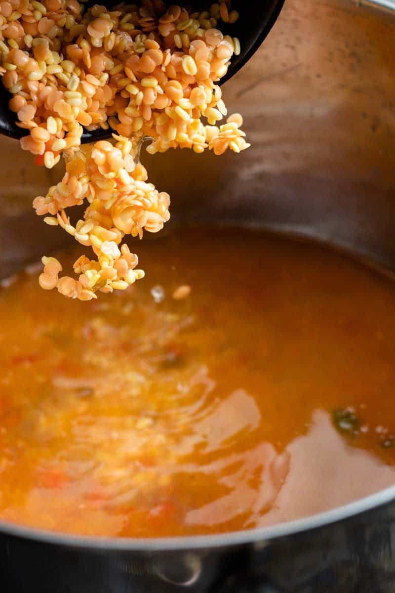 adding lentils to pot