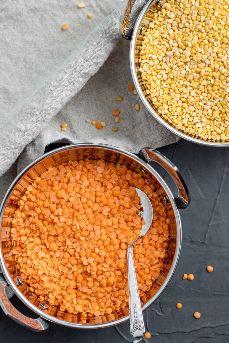 yellow and red lentils in bowls