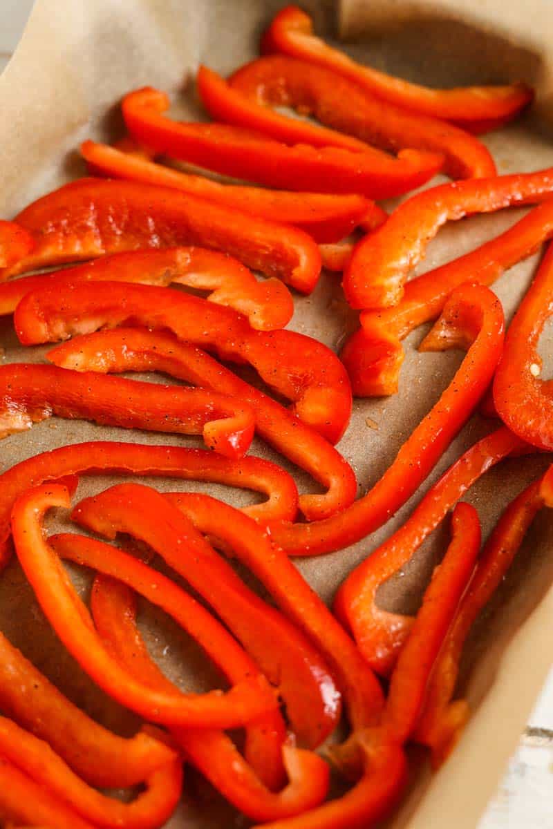 roasted red peppers on a baking sheet before baking