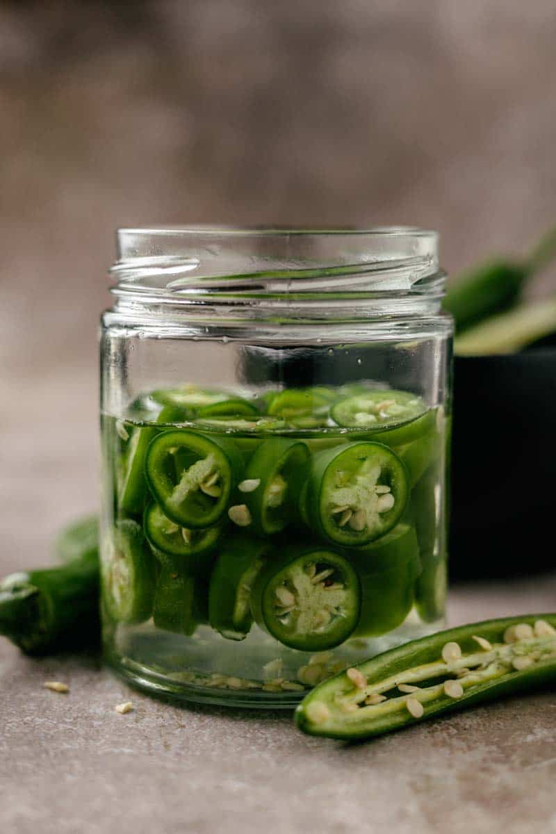 serrano peppers in pickling liquid