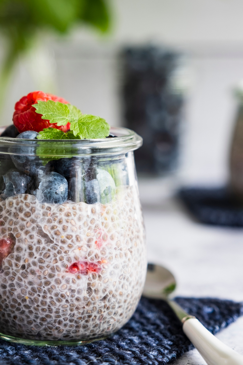 chia pudding in a jar on a surface.
