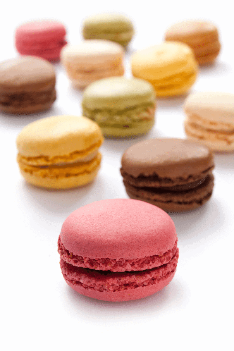 Macarons on a white surface.