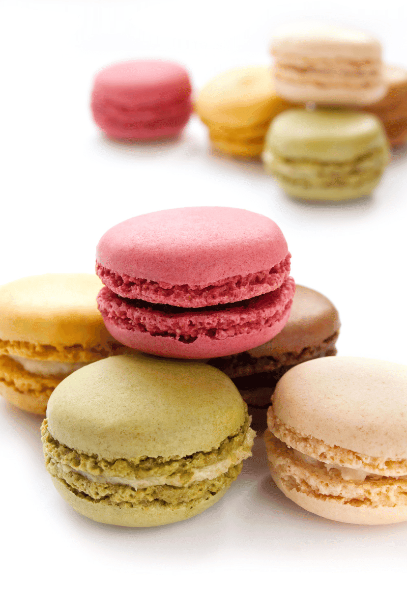 Macarons on a white surface.