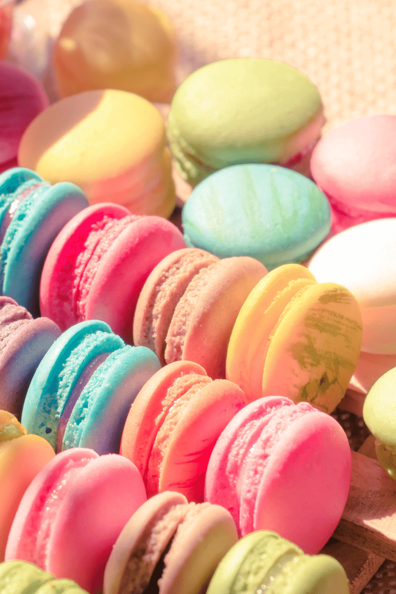 Colorful macarons on a surface.