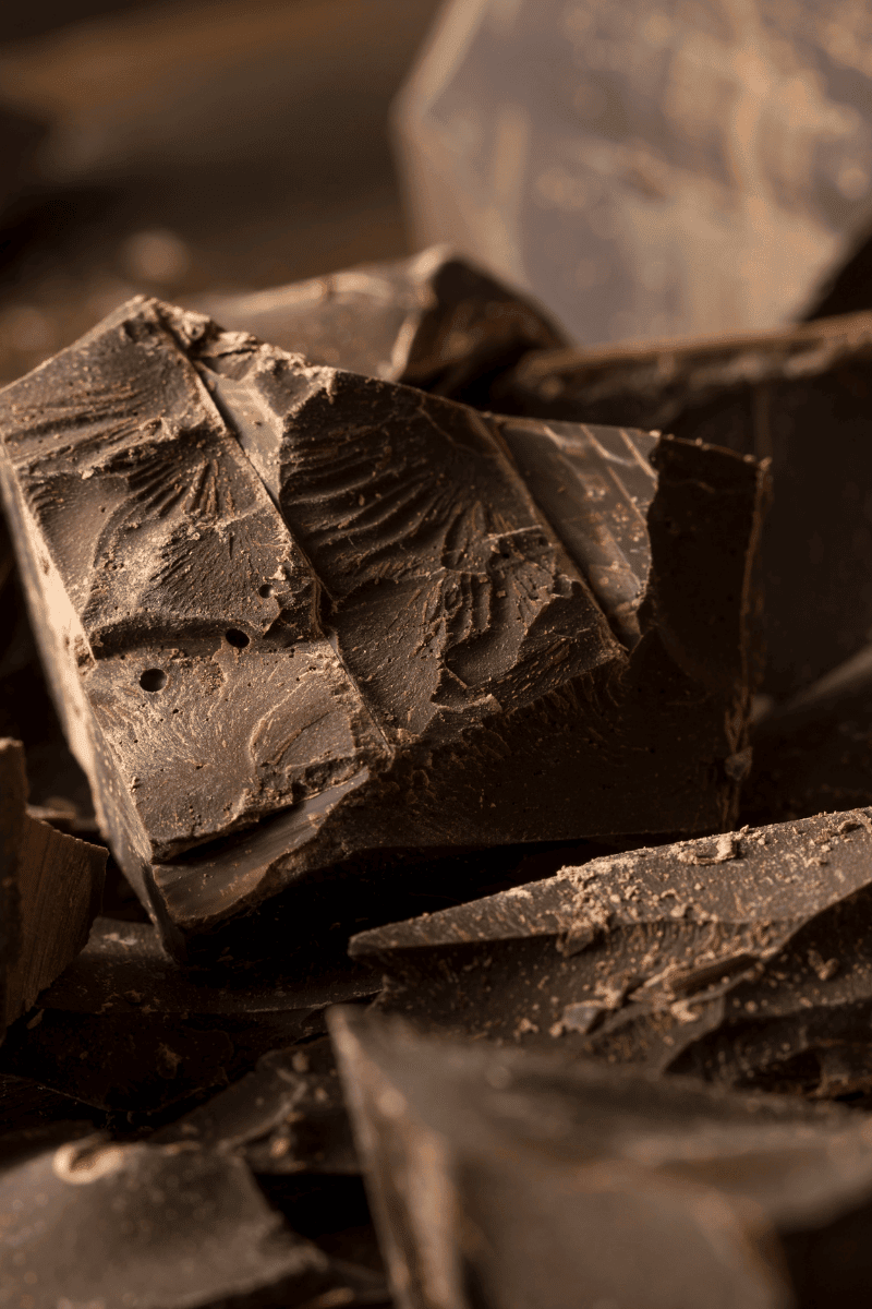 Semisweet baker's chocolate on a wooden surface.