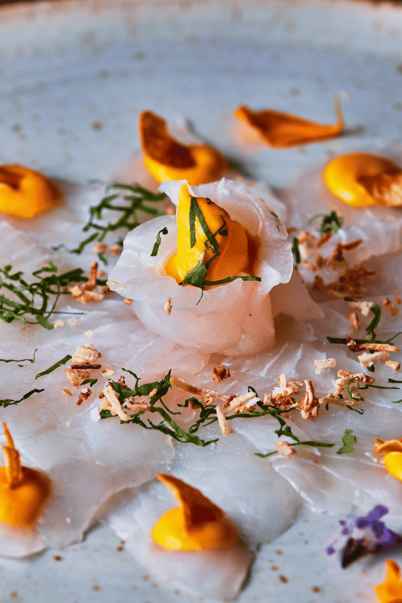 Raw Corvino ceviche on a plate.