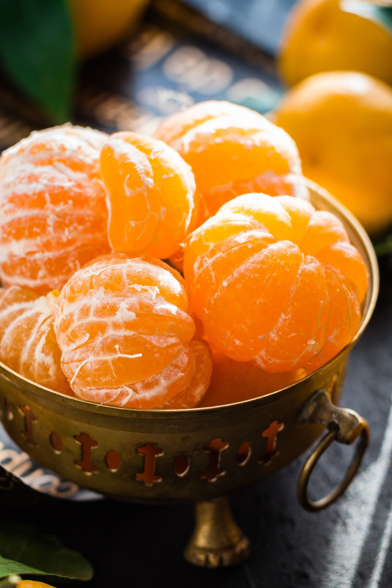 peeled mandarin oranges in a bowl.