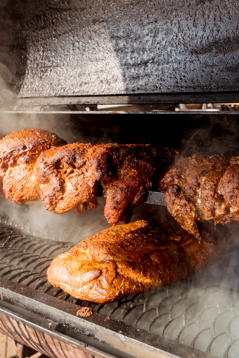 Meat in a BBQ smoker.