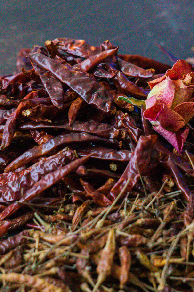 dried chili peppers on a dark background.